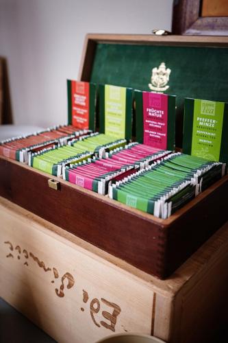 a wooden box full of books on a table at Hotel SLUNEČNÁ LOUKA in Lipno nad Vltavou