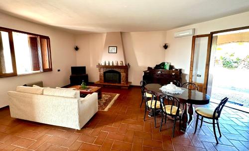 a living room with a couch and a table at Villa Rina in Avola