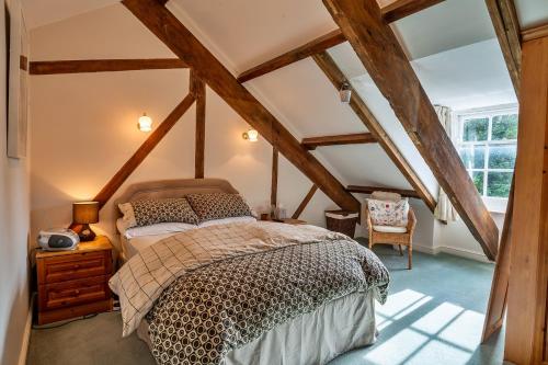 a bedroom with a bed in the attic at Finest Retreats - Valley View in Camelford