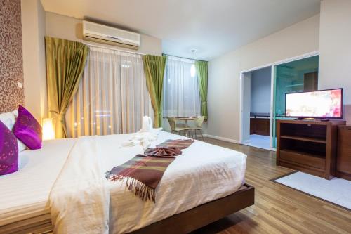 Ένα ή περισσότερα κρεβάτια σε δωμάτιο στο Baiyoke Ciao Hotel