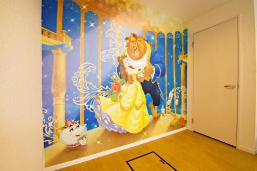 a room with a disney mural on the wall at Primehome Ninomiya in Fukiaichō