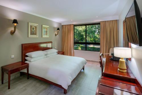 Katil atau katil-katil dalam bilik di Protea Hotel by Marriott Livingstone