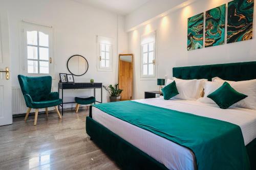 a bedroom with a large bed and a desk at Villa Nostos in Dhragoulás