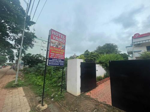 a hotel vortex sign on the side of a street at OYO Flagship Hotel Vaiko in Khandagiri