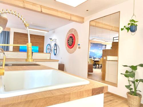 a kitchen with a large white tub in a kitchen at Best Butler Active Alpin Hund Küche Parken in Füssen
