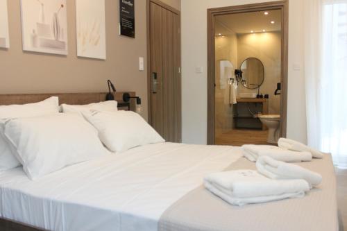 Ένα ή περισσότερα κρεβάτια σε δωμάτιο στο UrbanBay Hotel & Spa