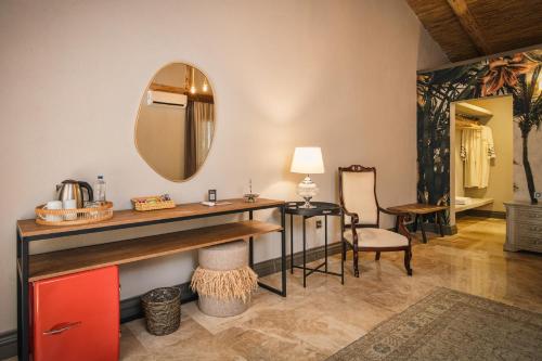 a bathroom with a vanity and a mirror on the wall at Layla Gocek Adults only in Göcek