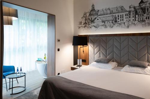 Postel nebo postele na pokoji v ubytování Focus Hotel Premium Kraków