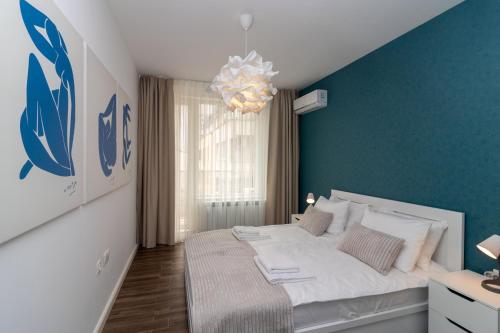 Ένα ή περισσότερα κρεβάτια σε δωμάτιο στο Central Sofia Condo