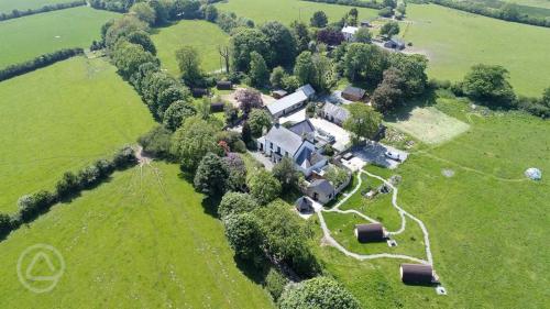 an aerial view of a house in a field at Bell Tents at Llanfair Hall in Llanfairpwllgwyngyll