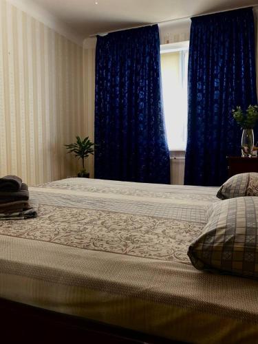 Ένα ή περισσότερα κρεβάτια σε δωμάτιο στο Babylon Apartments On Soborna 2rooms
