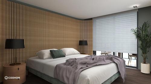 a bedroom with a large bed and a window at TOROS DELUXE RESORT HOTEL in Yesilovacık