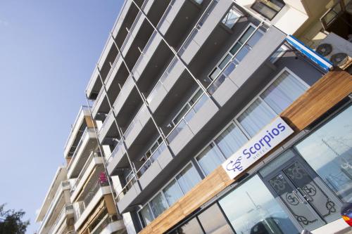 a store front of a building with a sign on it at Scorpios Sea Side Hotel in Piraeus