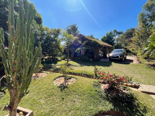 a car parked in front of a house with a cactus at Andapamanitra Résidence in Antananarivo