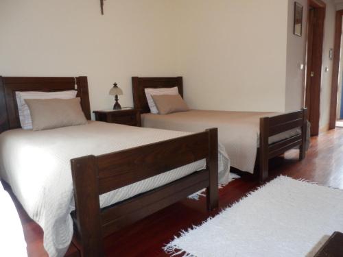 Postel nebo postele na pokoji v ubytování Quinta de São Simão Turismo e Eventos