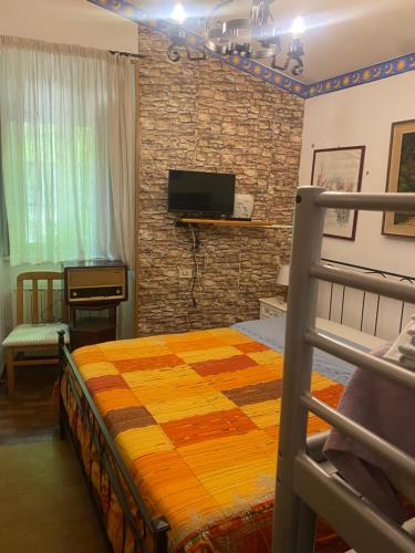 Ένα ή περισσότερα κρεβάτια σε δωμάτιο στο Casa di campagna