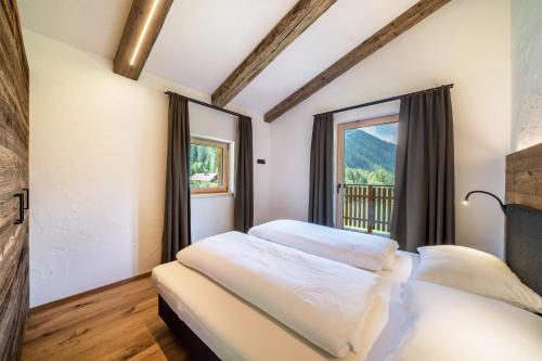 Postel nebo postele na pokoji v ubytování Chalet zu Wosser
