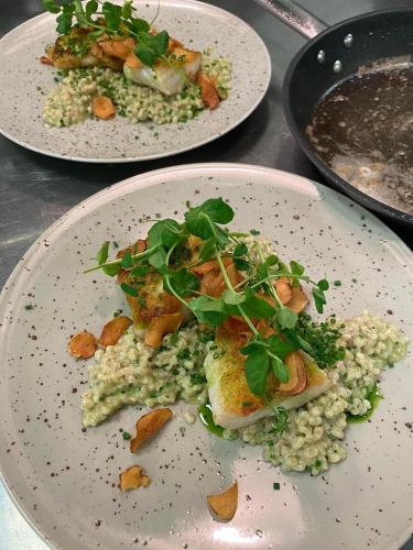 three plates of food sitting on a table at Sleeping barrel lodge Smaken av Ryfylke Event AS, drives ikke som hotell in Hjelmeland