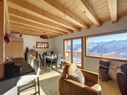 a living room with a view of a mountain at Chalet La Galise in La Toussuire