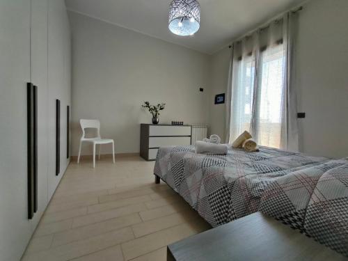 Una cama o camas en una habitación de Siracusa Suite, AC + Wi-Fi + Free Private Parking