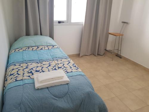 En eller flere senge i et værelse på Jazzy-Habitación en Dpto Compartido