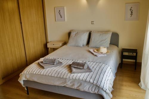 Postel nebo postele na pokoji v ubytování APARTAMENTO DO LAGAR
