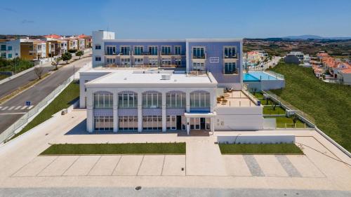 an aerial view of a building on a street at Ocean View Apartments in Lourinhã