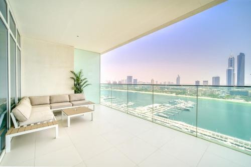 a living room with a view of the water at Sunrise Bay, Emaar Beachfront Dubai Harbour - Mint Stay in Dubai