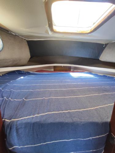 a bed in the back of a van with a window at Relax SEA in Barcelona