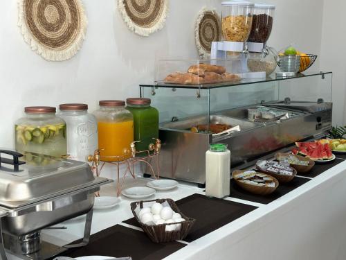 a kitchen with a counter with food on it at BLISS Hotel in Ksamil