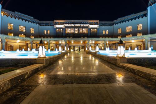 a building with lights in the middle of a courtyard at The Makadi Spa Hotel - Couples Only 18 Years Plus in Hurghada
