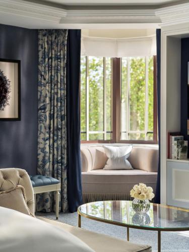 a living room with a couch and a table at The Dorchester - Dorchester Collection in London