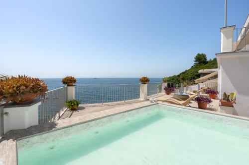 a swimming pool with a view of the ocean at Villa Lia in Massa Lubrense