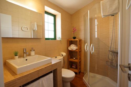 a bathroom with a sink and a toilet and a shower at Maspalomas Suite by "The Stay Las Palmas" VV in Maspalomas