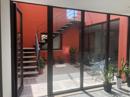a view of a house with a staircase and potted plants at Hostel S. Miguel FitNCare in Guarda