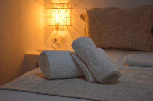 a pair of socks and towels on a bed at Summer Residence in Provatas