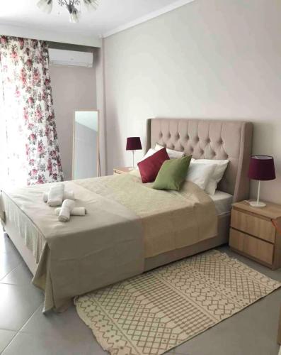 a bedroom with a large bed in a room at Elena's Beach house in Nea Irakleia