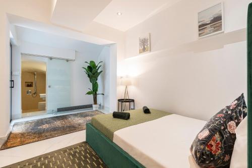 a bedroom with a bed and a bathroom at Stay at Kensington and Knightsbridge in London