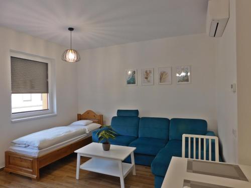 Posteľ alebo postele v izbe v ubytovaní Berki Apartman