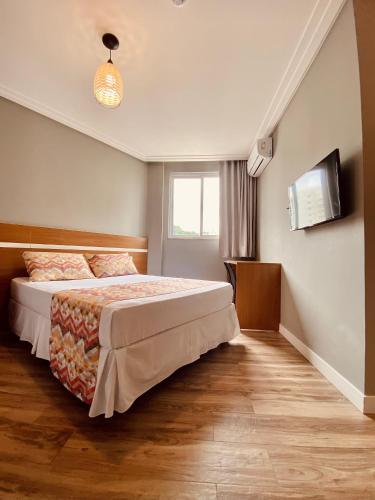Кровать или кровати в номере Hotel Porto Salvador