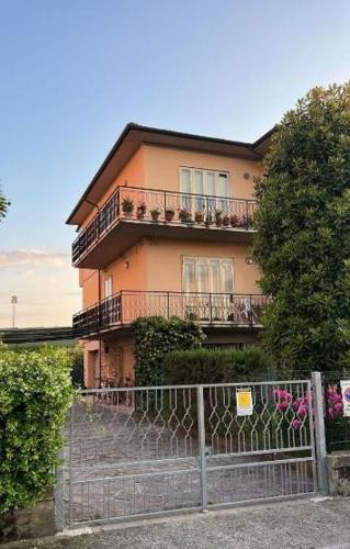 a house with a fence in front of it at B&B Francesco in Pisa