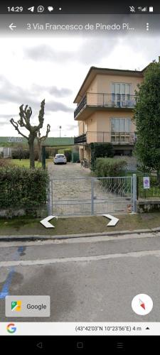 a house with a car parked in front of it at B&B Francesco in Pisa