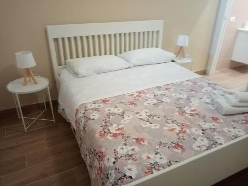 Ένα ή περισσότερα κρεβάτια σε δωμάτιο στο Egea Casa Vacanza
