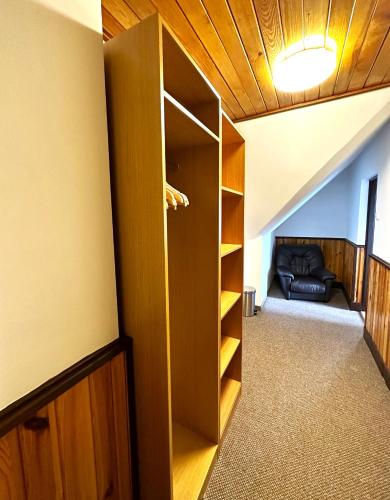 a room with a closet with a couch in it at Obří Sud Libverda *** in Lázně Libverda