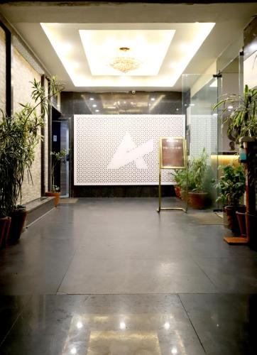 a lobby with a large screen in the middle of a building at HOTEL BLUE PEARL in Bhopal