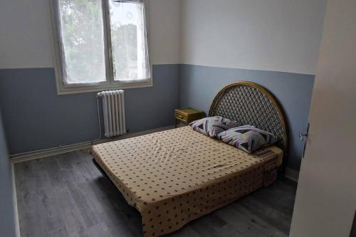 En eller flere senge i et værelse på Appartement T3 68 M2 Saint Avertin.