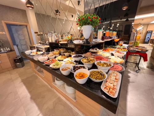 a buffet line with many different types of food at Old Town Point Hotel & Spa Antalya in Antalya