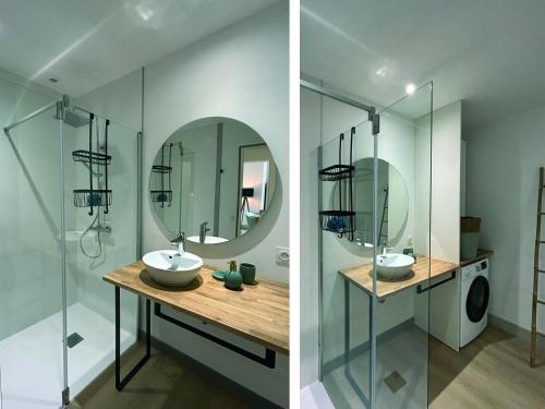 a bathroom with a sink and a mirror at Au Colombier in Hillion