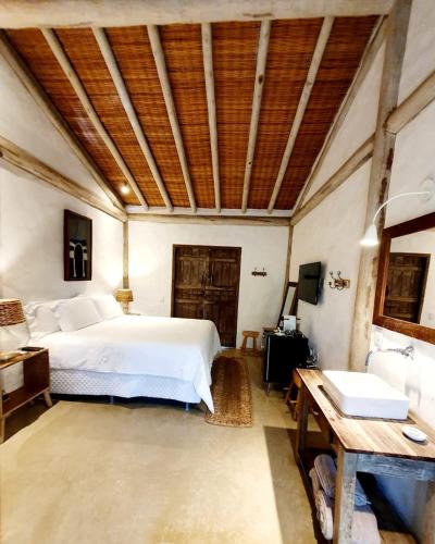 Ένα ή περισσότερα κρεβάτια σε δωμάτιο στο Villa Fulô