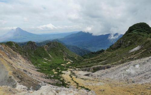 a view of a mountain valley with a dirt road at Villa Highland No 7 M Berastagi View in Berastagi